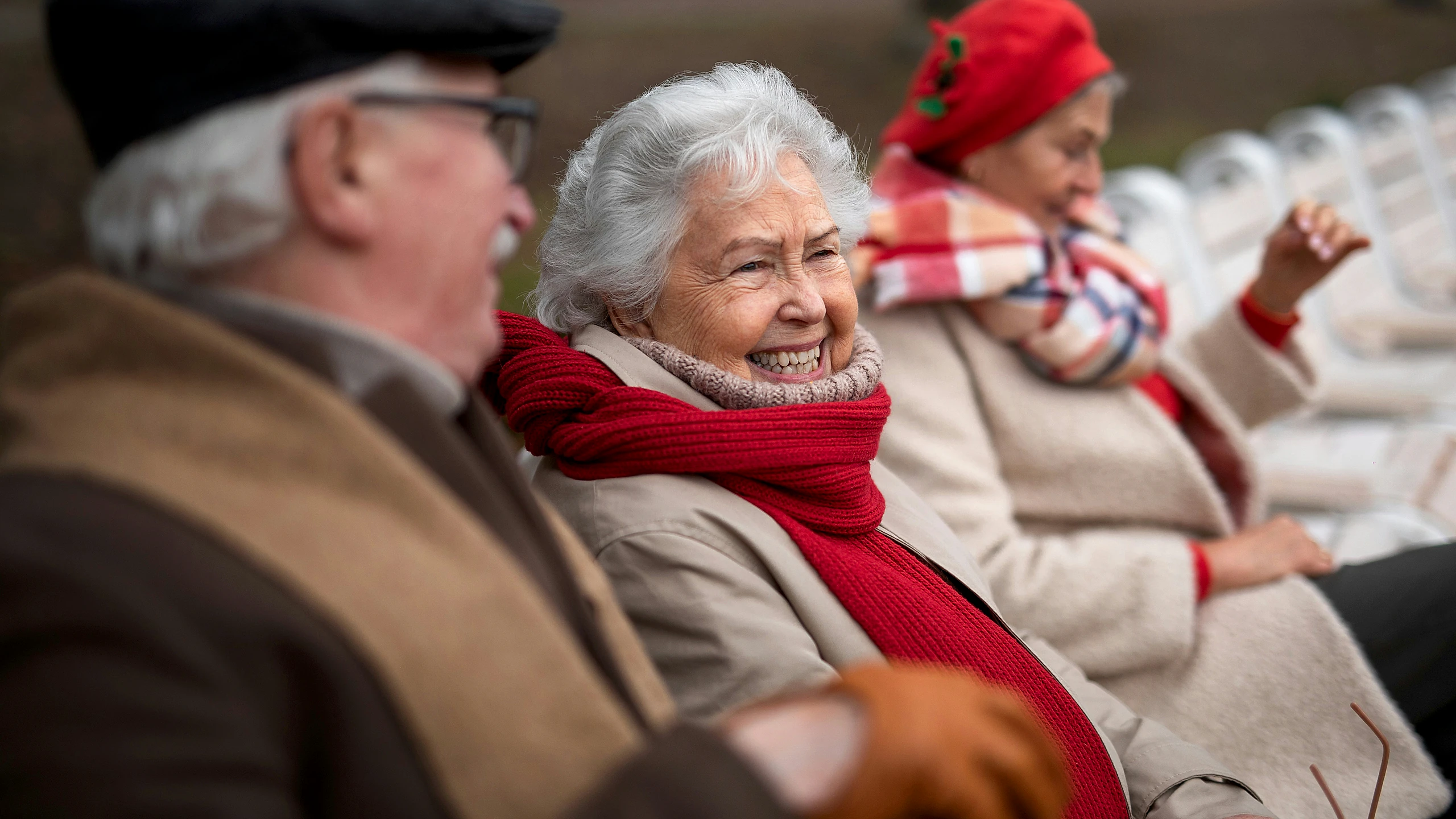 British seniors sitting outside together